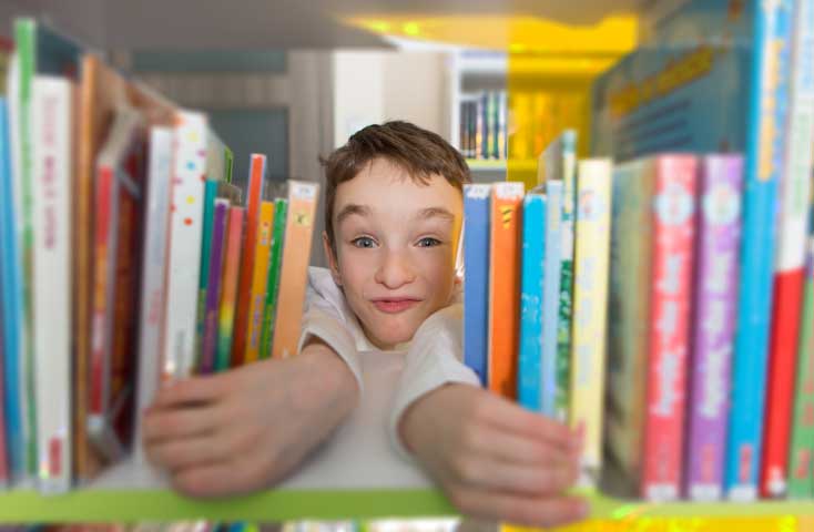 Third Grader, Tim Spear shows excitement at opening of Sunnyside Library
