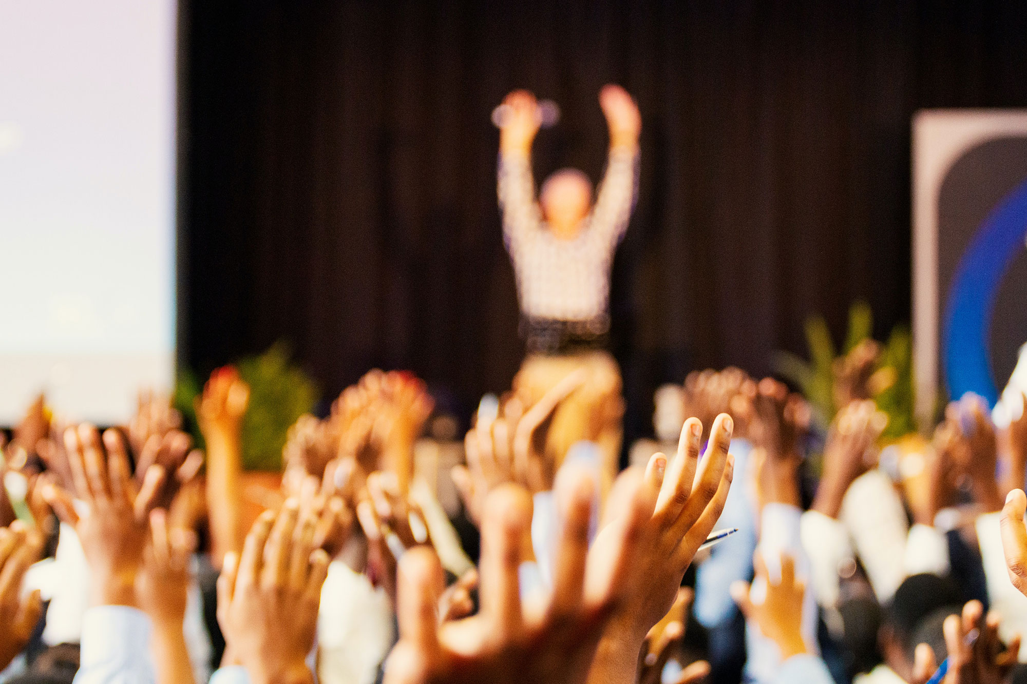 hands in the air at a ceremony