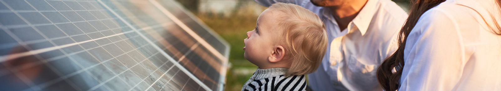 baby looking at solar panels